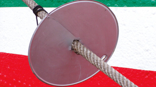 A CD being used to prevent rats from getting on a boat