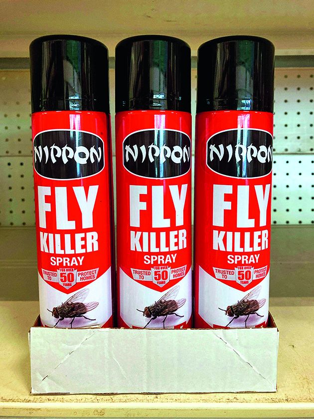 Cans of fly spray in a supermarket