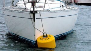 a boat tied to a mooring buoy