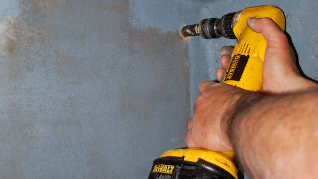 A person using a drill on a boat, , part of tools for tight spaces to have onboard