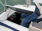 A person using tools for tight spaces on a boat
