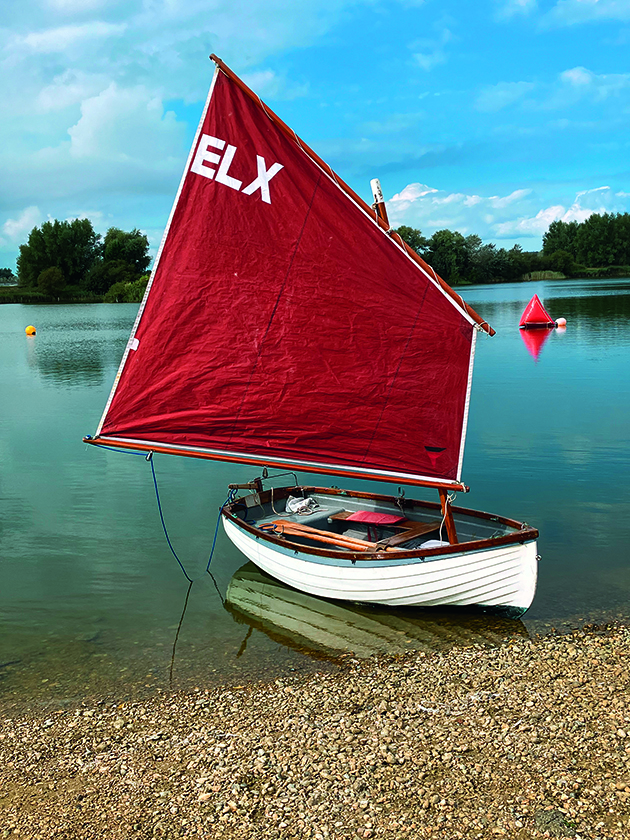 An Emsworth lugger boat beached