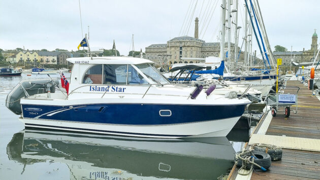 A Beneteau 760 mooored by a pontoon