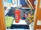 A man working in the engine bay of a Beneteau 760