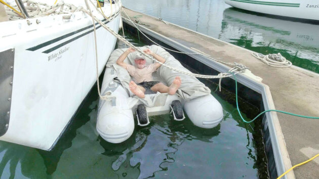 a man relaxing in a dinghy