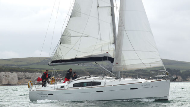 A yacht sailing along the coast