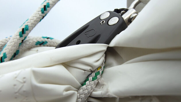 Clew blocks on a slab reefing system on a boat