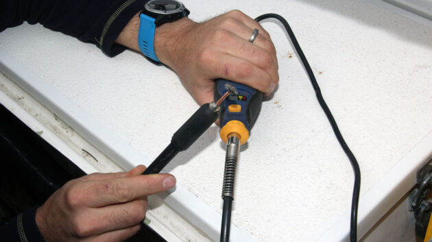A Dremmel flexible drive being used on a boat, , part of tools for tight spaces to have onboard