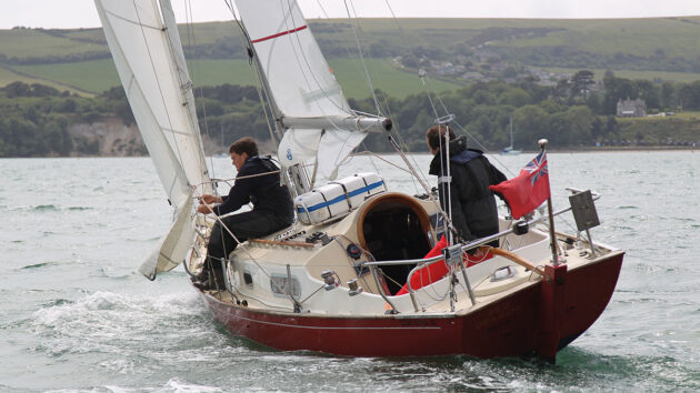 Two men sailing a yacht