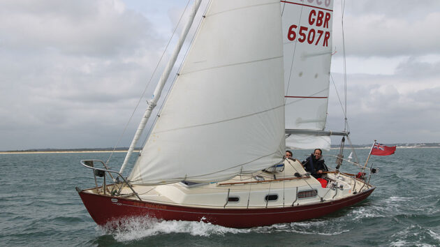 A yacht sailing with slab reefing