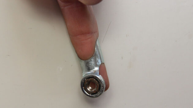 A finger spanner being used on a boat, , part of tools for tight spaces to have onboard