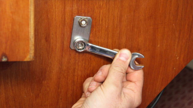 A stubby spanner being used on a baot