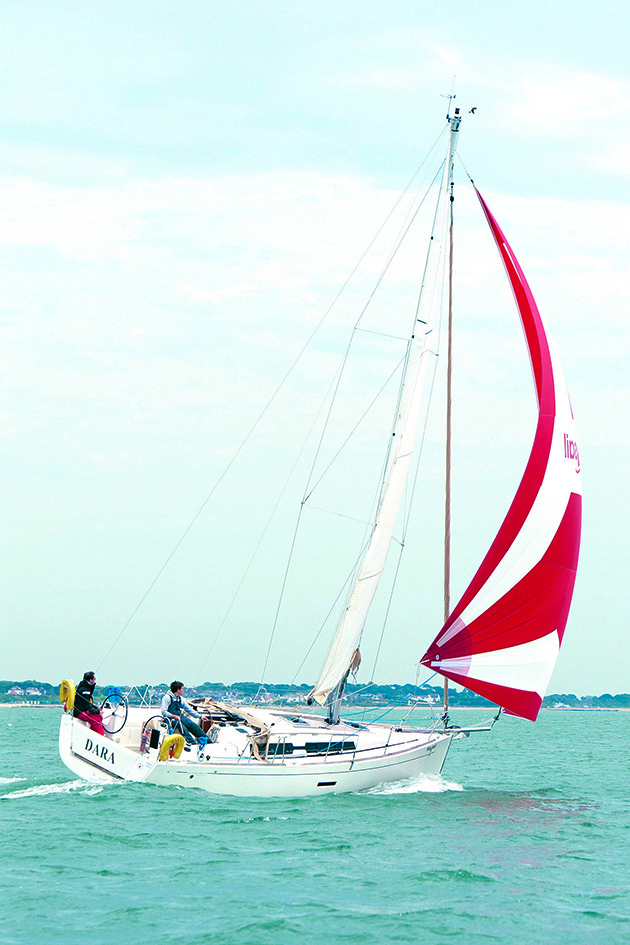 A yacht flying a cruising chute