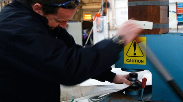 A man using a hydraulic press