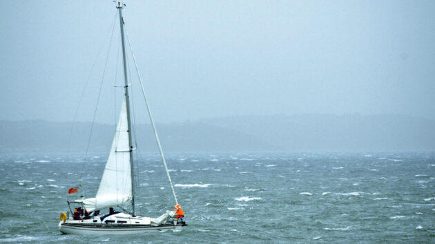 A yacht sailing in blustery conditions