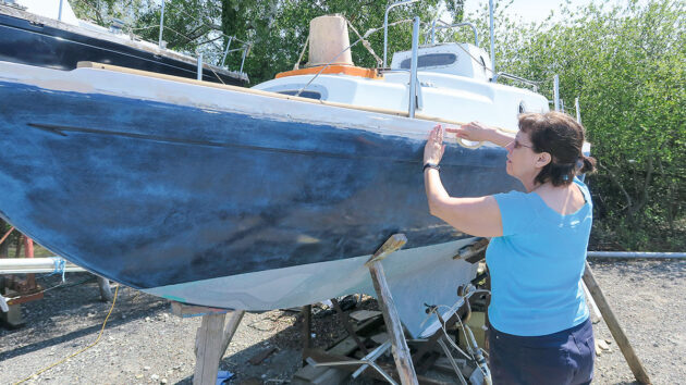 Masking tape being applied to a boat ahead of fitting a PVC gunwale