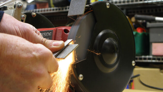 The end of a chisel being ground off