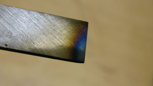 Blue end of a chisel indicating it has been overheated