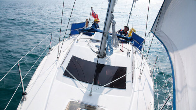 Two people sailing a Jeanneau Sun Dream 28