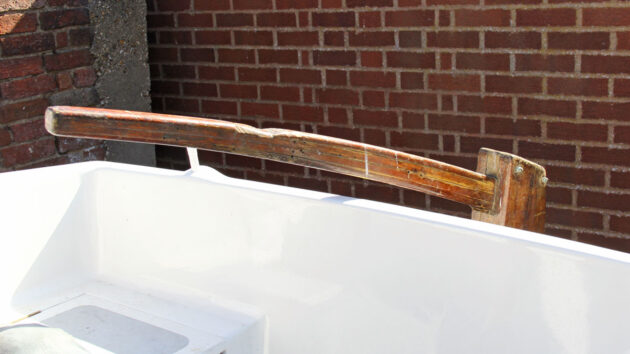 A tiller on the back of a boat