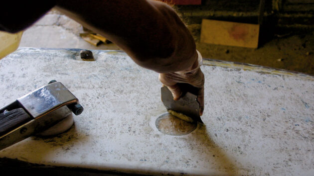 A man doing boat maintenance