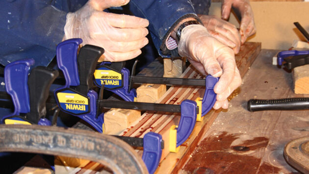 Clamps being used to make wood laminate