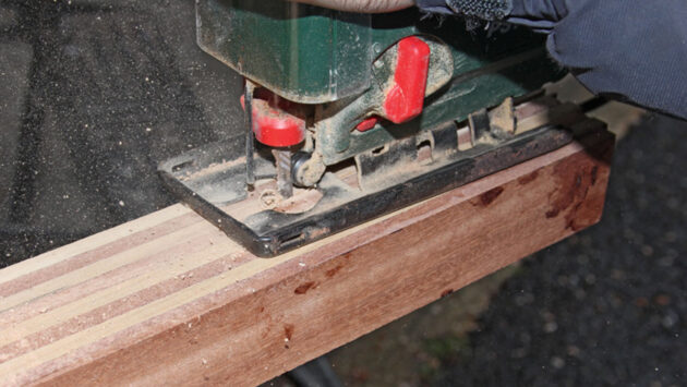 A jigsaw being used to make a tiller for a boat