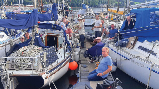 People on a pontoon having a party before a boat leaves for an Atlantic circuit