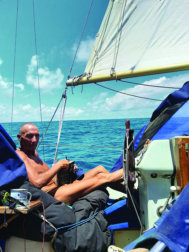 A man sitting in a beanbag on a boat while sailing an Atlantic circuit