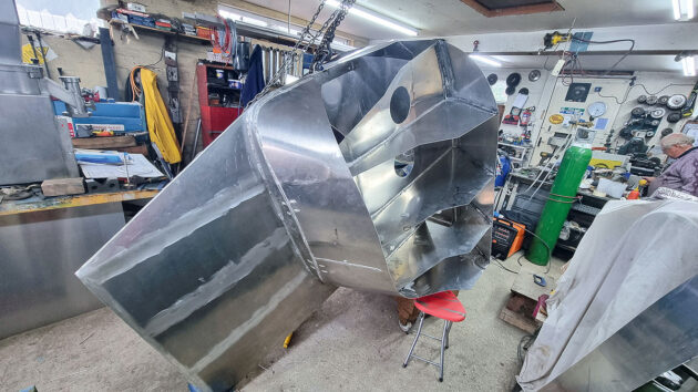 A microyacht under constriction in a workshop