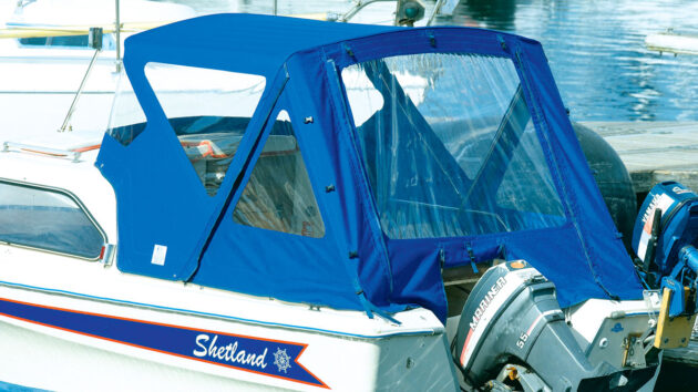 A boat canopy on a boat with an outboard