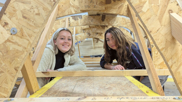 Two women working on boatbuilding