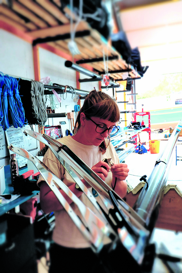 A woman working on boat rigging