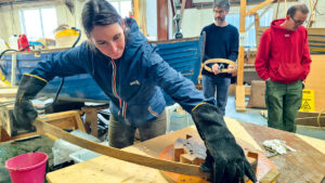 A women working on boatbuilding