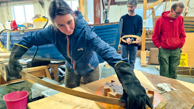 A women working on boatbuilding