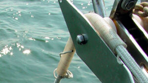 A rope covered in plastic tubing to protect against rope chafe