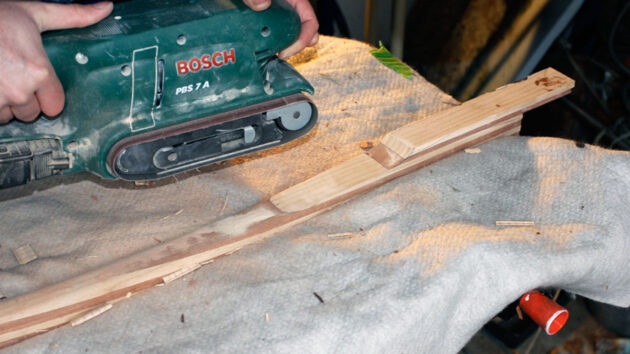 A man using a sander