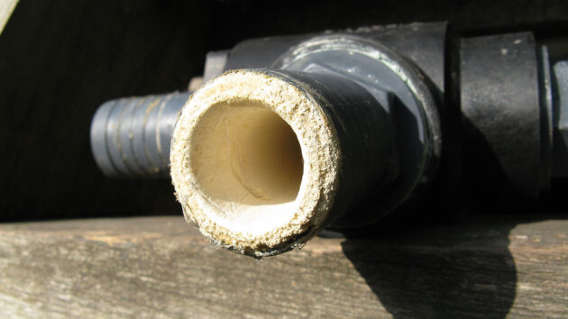 Scale build up in a toilet hosepipe on a boat