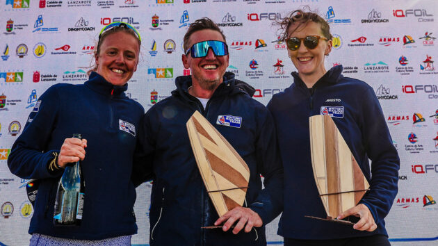 iQFOiL athletes Emma Wilson (left) and Islay Watson (right) with coach Sam Ross. Credit: Sailing Energy