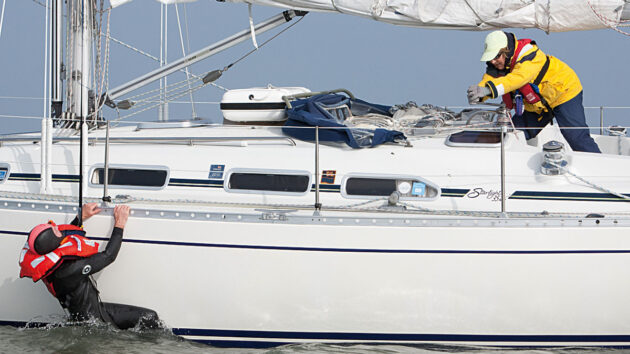 A person being winched onto a boat