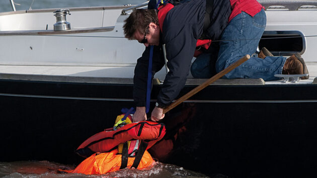 A man recovering a dummy from the water
