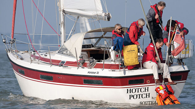 A crew recovering a person in the water