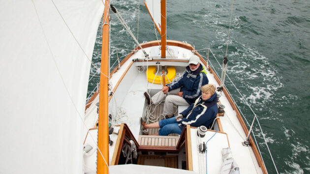 Two people sailing a Golant Yawl