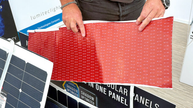 A man holding 3M sticky tape