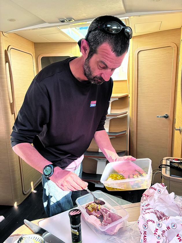 A man cooking on a boat
