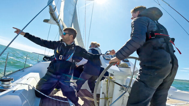 Boat crew in the cockpit of a yacht