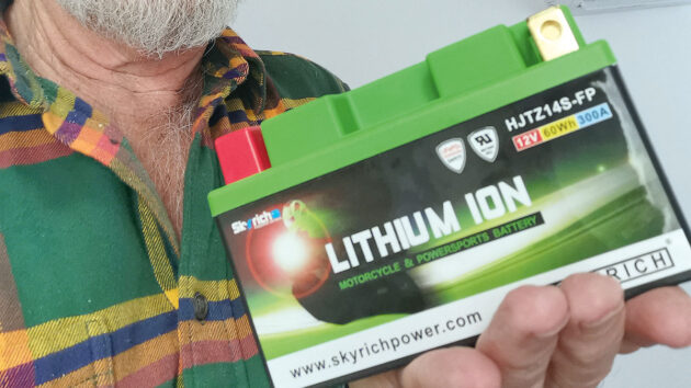 A man holding a lithium battery
