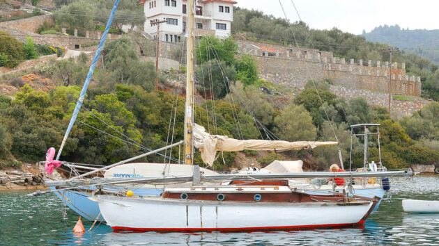 A boat on the water with its mast unstepped