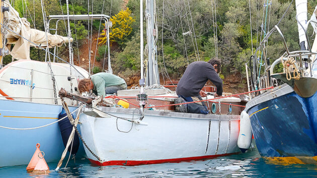 Two men working on a boat