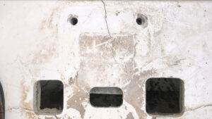 A cracked anchor windlass panel on a boat